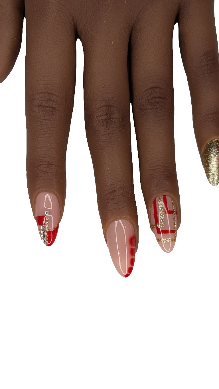 Nail art with red and gold design on a white background