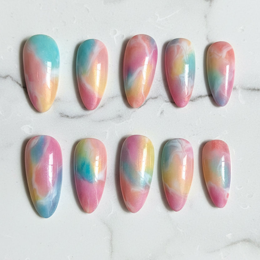 Set of rainbow-colored nail art designs on a marble surface. Handmade Nails, Press On Nails, Nail Art, Marble Nails, Almond Shape, Pastel Aesthetic, Luxury Press Ons, Custom Manicure, Aura Nails, Tik Tok Nails