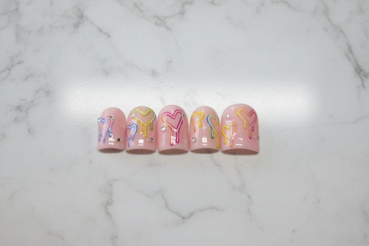 Pastel press on nails

Drip heart nail art

Y2K aesthetic nails

Pink custom fake nails

Kawaii gel nails

Handpainted fake nails

Cute summer manicure

Rhinestone nail art

Glued on nails reusable

Valentine heart nails

Trendy false nails

Indie alt style nails

Fake nails short medium