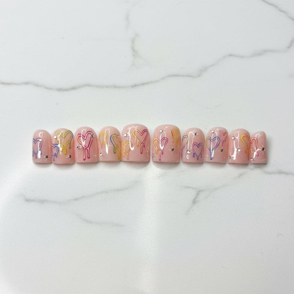 Pastel press on nails

Drip heart nail art

Y2K aesthetic nails

Pink custom fake nails

Kawaii gel nails

Handpainted fake nails

Cute summer manicure

Rhinestone nail art

Glued on nails reusable

Valentine heart nails

Trendy false nails

Indie alt style nails

Fake nails short medium