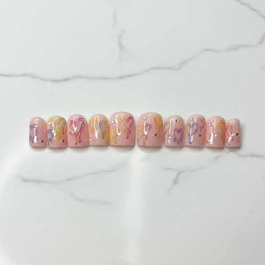 Pastel press on nails

Drip heart nail art

Y2K aesthetic nails

Pink custom fake nails

Kawaii gel nails

Handpainted fake nails

Cute summer manicure

Rhinestone nail art

Glued on nails reusable

Valentine heart nails

Trendy false nails

Indie alt style nails

Fake nails short medium