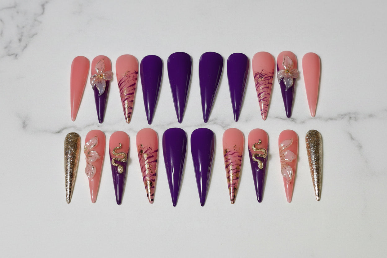 Set of decorative nail art on artificial nails with royal purple tone and the elegant 3D floral accents