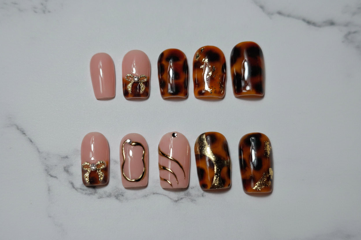 Luxury press on nails, Gold bow charms, Handmade press ons	Tortoiseshell nails